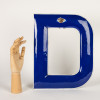 Enameled letter "D"